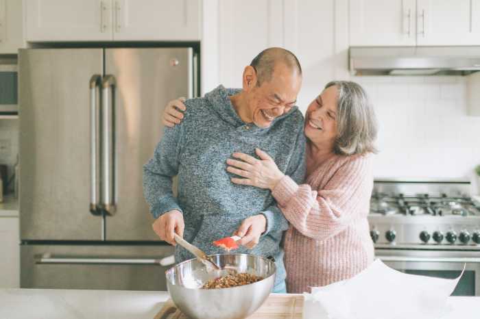 Happy couple on open concept dining romm